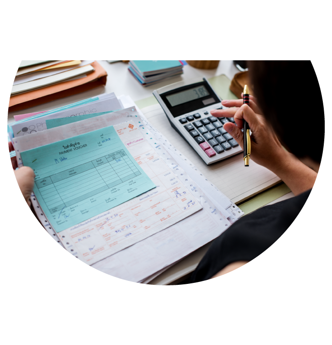 Employee Calculating Taxes